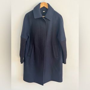 Dark blue coat in a small with sweater sleeves in black